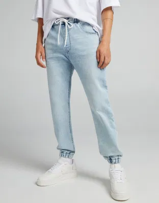 Atacado masculino designer elástico sino inferior macio denim joggers jeans